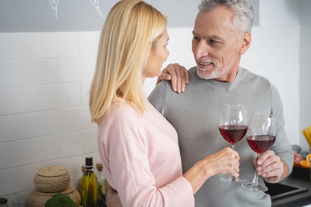 Romantic date with wine in the kitchen stock photo - Photo, Image