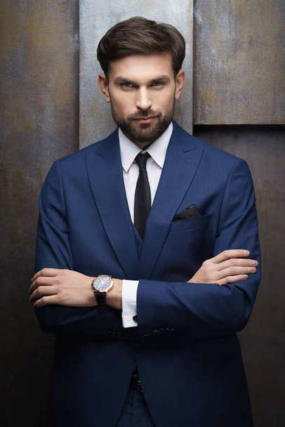 indoor photo of young handsome stylish businessman wearing suit - Фото, зображення