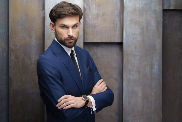 indoor photo of young handsome stylish businessman wearing suit - Foto, Bild