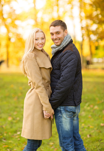 Romantic couple in the autumn park - Фото, зображення