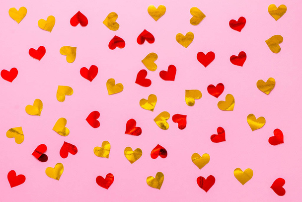 Red and golden scattered paper hearts confetti background - Photo, Image