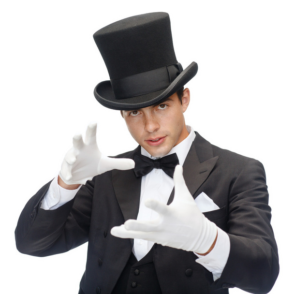 Magician in top hat showing trick - Foto, Bild