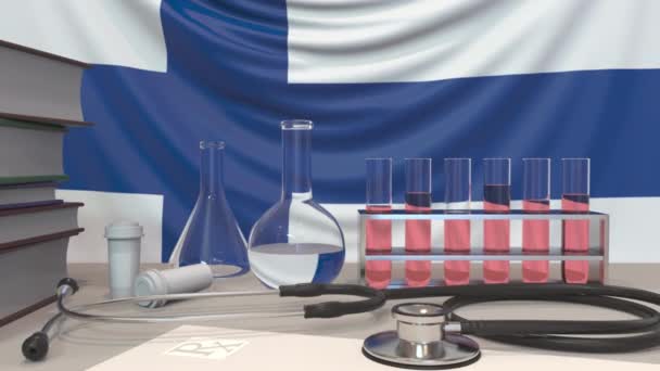 Clinic laboratory equipment on Finnish flag background. Healthcare and medical research in Finland related conceptual animation - Video