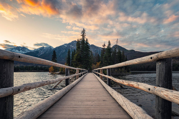 Wooden bridge in Pyramid lake with colorful sky at evening - Photo, Image