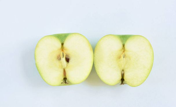  green apple healthy fruit half cut on white background - Фото, изображение
