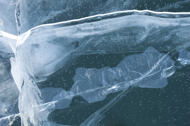 Cracks in turquoise ice of Baikal lake - Foto, Imagen