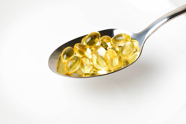 Fish oil capsules in the spoon. - Photo, Image