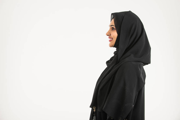 Arabic woman with abaya in studio - Фото, изображение