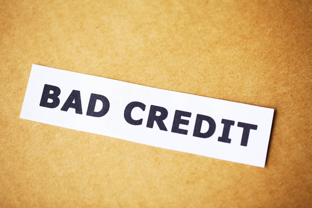 Bad credit, written on a white sheet of paper - 写真・画像