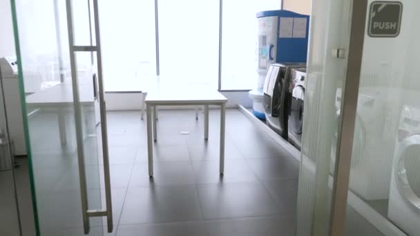Public Laundry with Washing Machines in Modern Condominium in Bangkok - Felvétel, videó