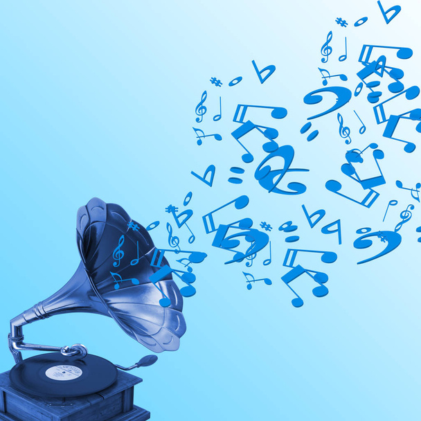 Gramofon z nutami pływającymi z niebieskim tłem - Zdjęcie, obraz