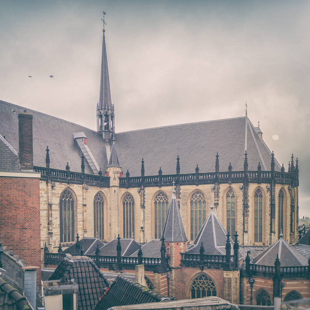 View of the spire and walls of the Westerkerk church in Amsterdam - Φωτογραφία, εικόνα