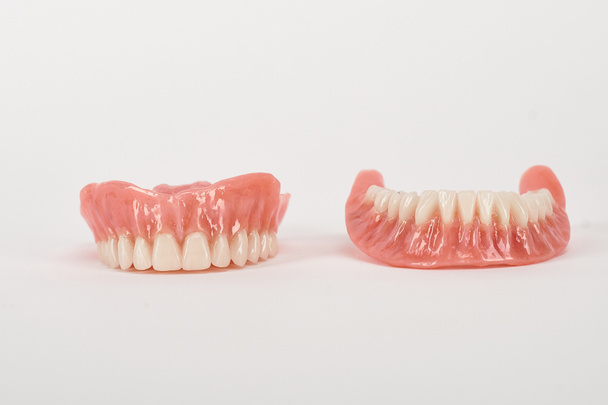 False prostheses. Dental hygienist checkup concept. Full removable plastic denture of the lower jaw. - Photo, Image