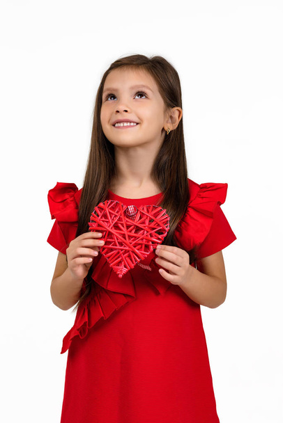 valentines day. smiling child girl with red heart - Fotó, kép
