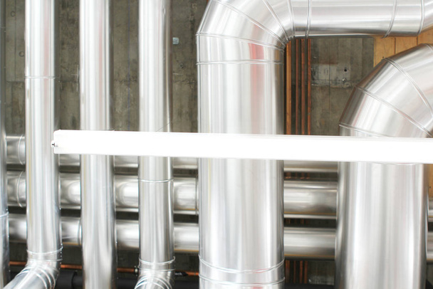 chrome pipes in heating and AC rooms in buildings of factories a - Photo, Image