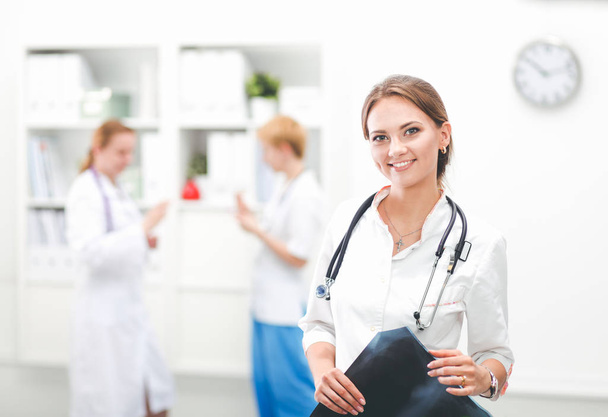 Smiling medical doctor woman with stethoscope in hospital - Zdjęcie, obraz
