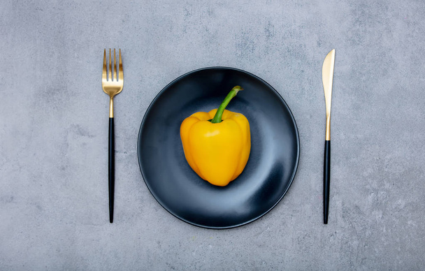 pepper in a plate with fork and knife  - Photo, Image