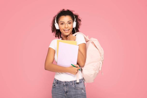 Happy student girl with backpack and notebooks. - Valokuva, kuva