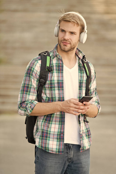 College life. College student headphones smartphone. Online course. Audio book concept. Educational technology use physical hardware software and educational theoretic. College education concept - Photo, Image
