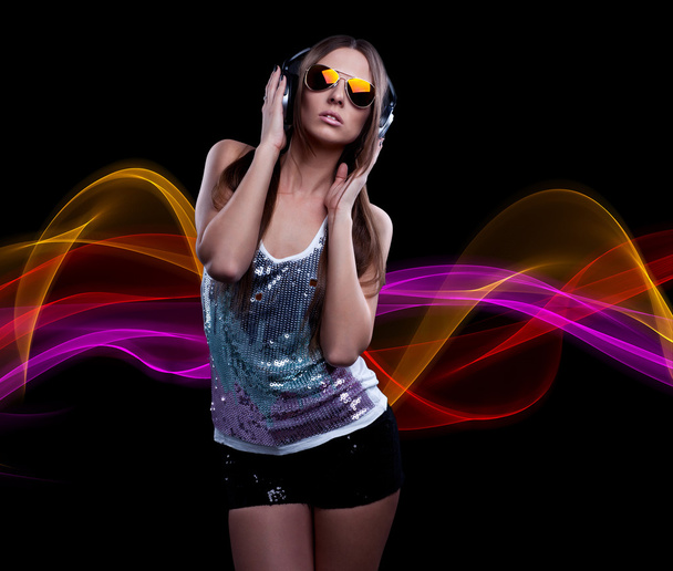 young DJ woman enjoying the music in the headphones - Zdjęcie, obraz