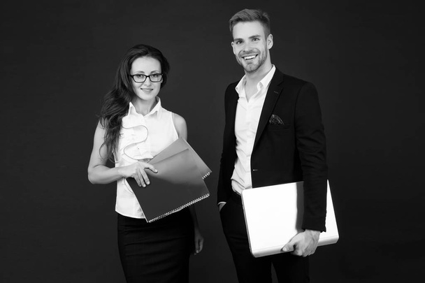 Entrepreneurial relationship. Couple of business partners. Business professionals at work. Sexy woman and handsome man hold business papers. Formal business meeting - Photo, image