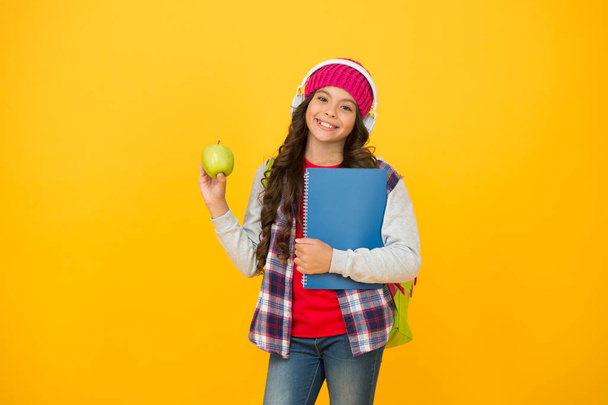 Give me break. Happy child hold apple yellow background. Little girl enjoy school break. Healthy eating and snacking. Natural snack break. Food and nutrition. Autumn holidays or break - Foto, Imagem
