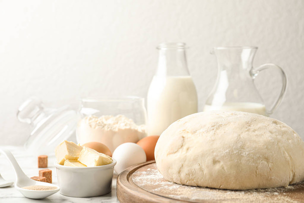 Fresh dough for pastries on white marble table - Fotó, kép