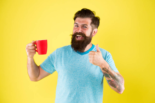 starting day with good drink. good morning coffee. Water balance and health care. Bearded man enjoy morning routine. sip of inspiration. hot drink mug. man casual style drink tea - Foto, Bild
