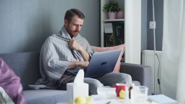 Young man working from home during illness. Online education. - Materiaali, video