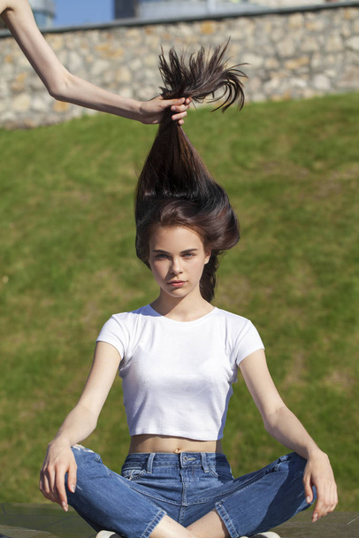 Young beautiful teenager girl posing against summer park, bright - Φωτογραφία, εικόνα