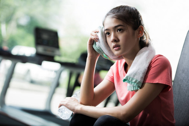 Asian women are resting after a workout gym  - Photo, Image