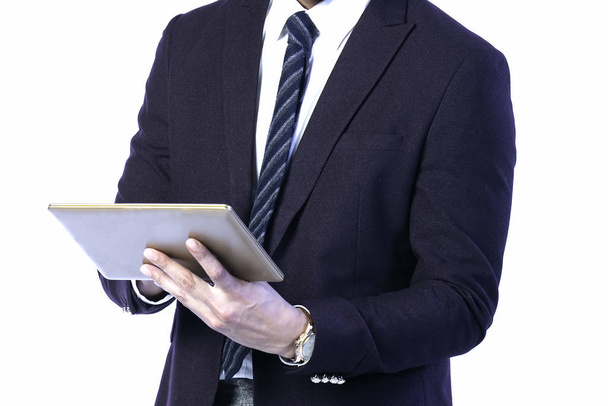 Tablet in the hands of a business man wearing a suit. Working to - Foto, Imagem