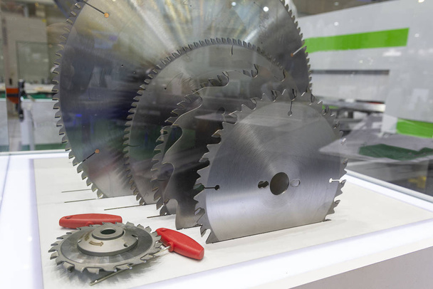 Cutters and saws for metal on display close-up. Industry - 写真・画像