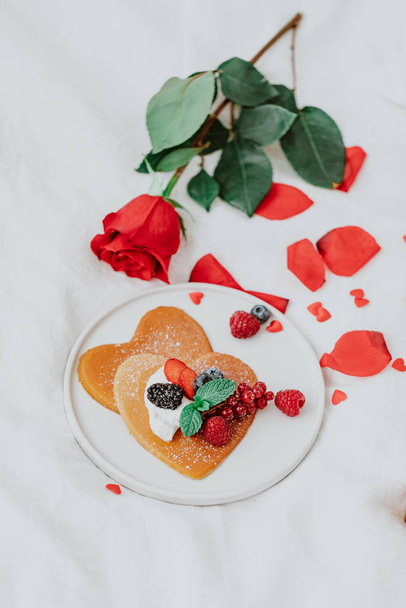 Valentine's Day heart shapes pancake with berries.. morning breakfast with coffee and pancakes - 写真・画像