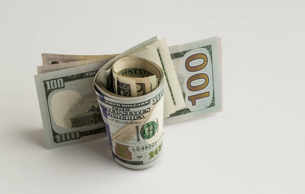 close-up shot of dollar bills on white tabletop - Φωτογραφία, εικόνα