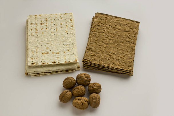 close-up shot of matzah bread and walnuts - Photo, image