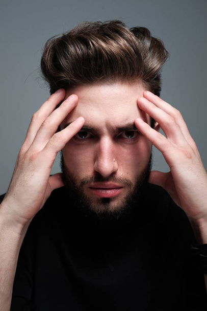 portrait of handsome young man with stressed expression  - Photo, Image