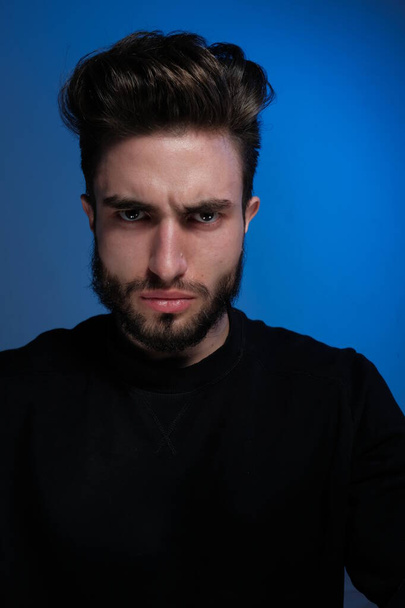portrait of handsome young man with angry expression  - Foto, Imagen