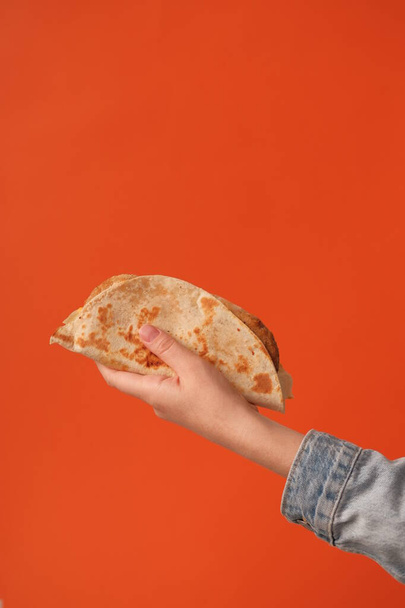 Hand holding taco close-up view - Фото, изображение