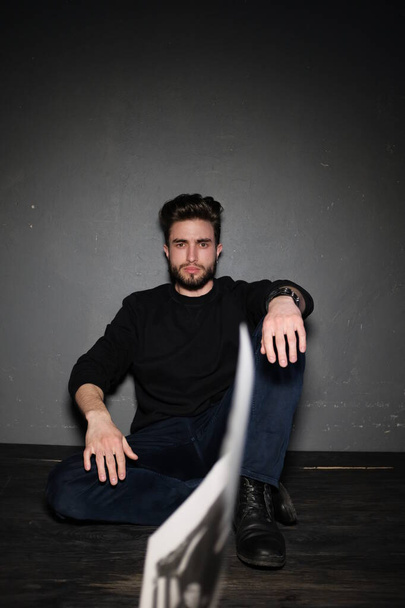 handsome young bearded man sitting on the floor   - Foto, Imagem