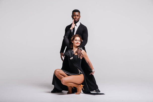 Couple dancers posing over white background. Dance school concept - Photo, Image
