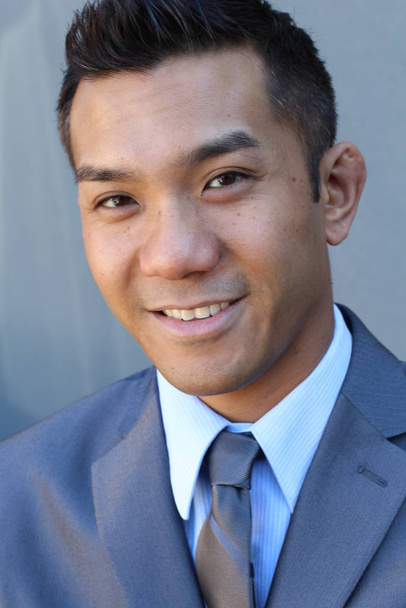 close-up portrait of handsome young businessman in grey suit of mixed race - Fotoğraf, Görsel