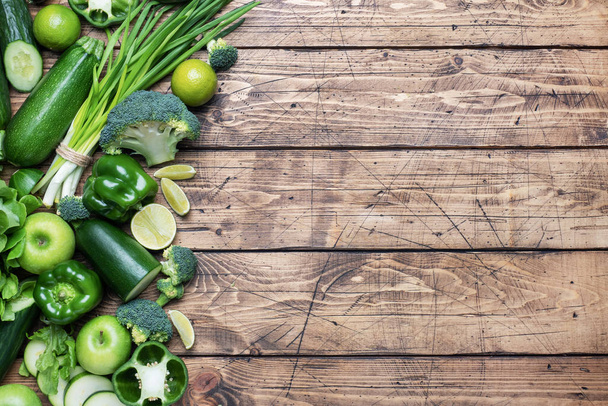 Frame Fresh green vegetables and herbs on a wooden background. Copy space. - Fotoğraf, Görsel