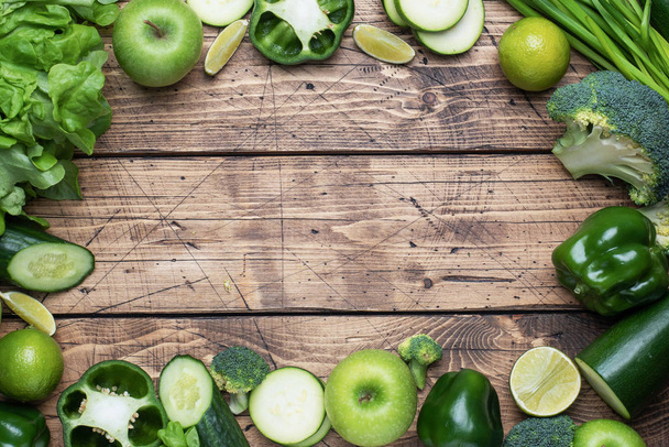 Frame Fresh green vegetables and herbs on a wooden background. Copy space. - Foto, Imagem