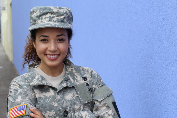Military girl on blue background with copy space - Photo, Image