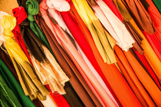 Closeup shot of multicolored pieces of clothing next to each other - Foto, immagini