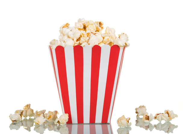 Popcorn in large square box and near isolated on white. - 写真・画像