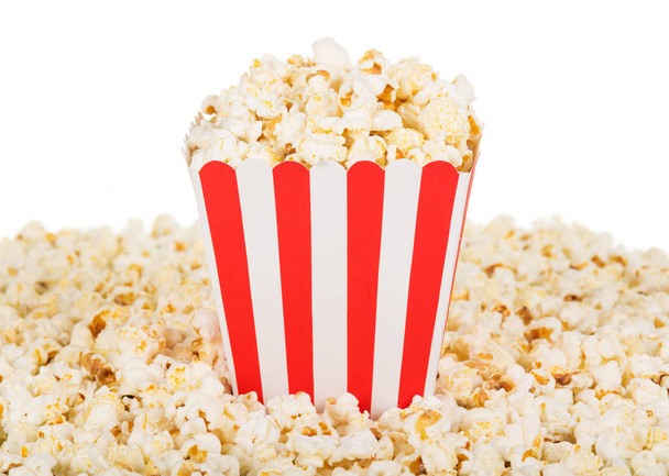 Large square box popcorn and are many around, isolated on white. - 写真・画像