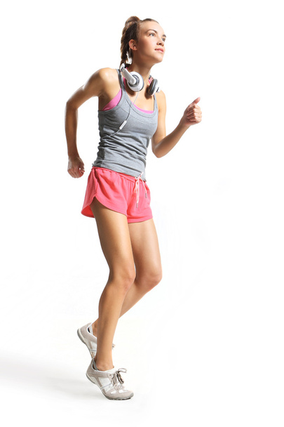slim attractive woman trains running - Foto, Imagem