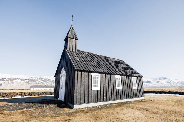 beautiful old and alone black church on valley in Iceland mountains with black church background - Fotografie, Obrázek